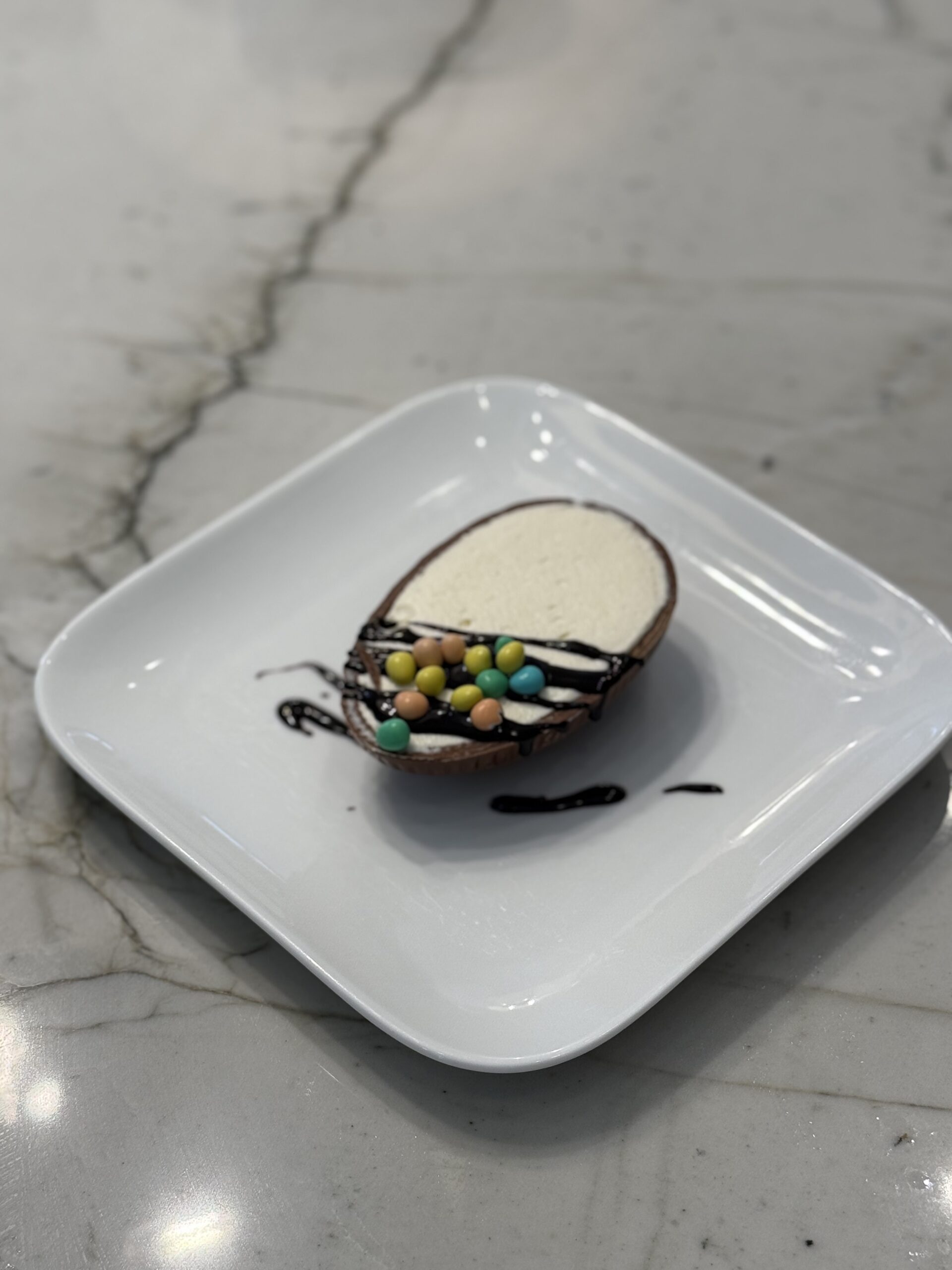 Chocolate Easter Egg filled with Cheesecake and chocolate drizzle
