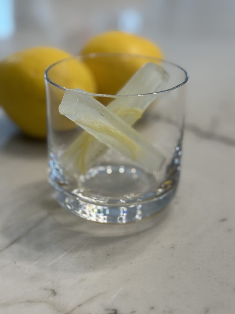 Modern and Interesting Cocktail Garnish Ideas: Ice cubes with citrus strips