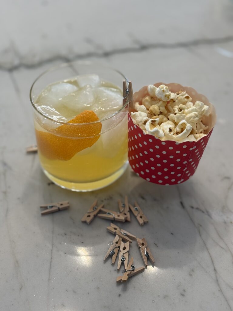 The Golden Kernel: A Citrus Rum Cocktail with a Popcorn Nibble