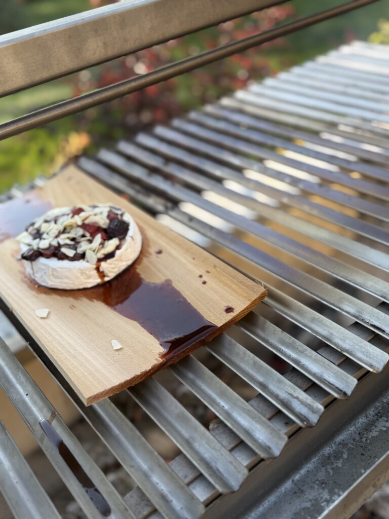 cedar planked brie with strawberry balsamic drizzle
