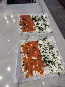Spread salmon on half of pastry sheet